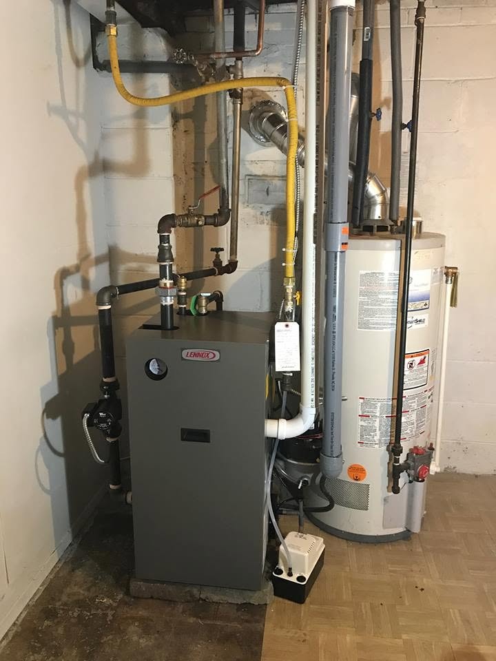Technician inspecting gas furnace Vaughan home